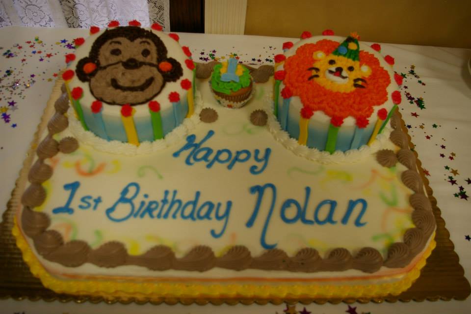 1st birthday cake with custom character drawings and baby smash cupcake